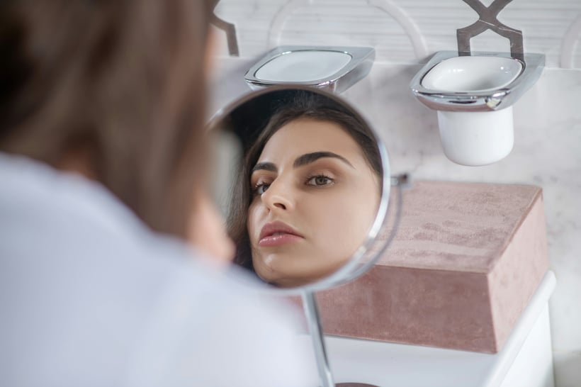 woman checking skin